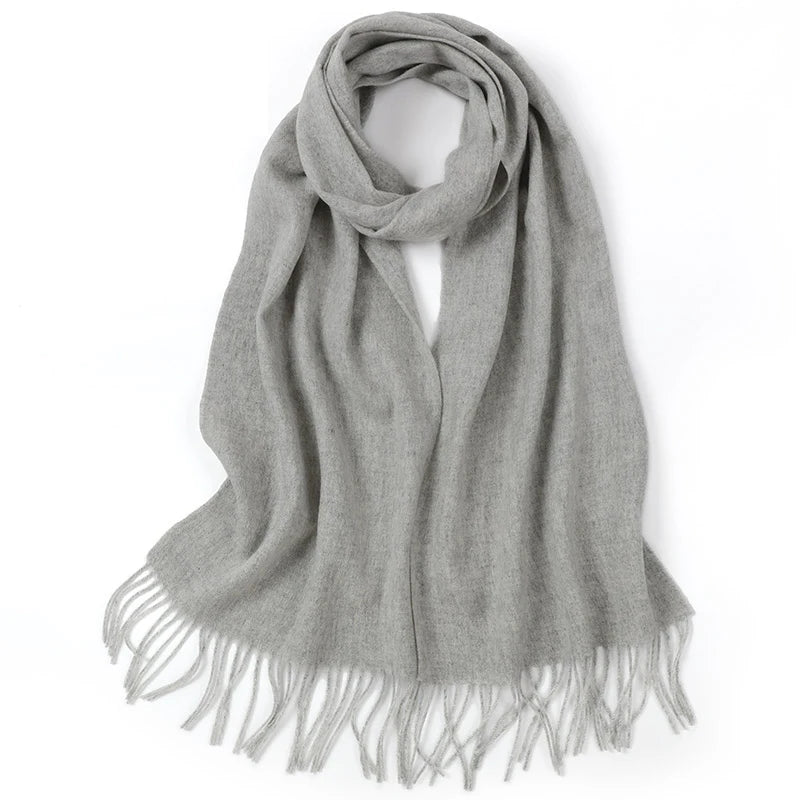 a gray scarf with fringes on a white background