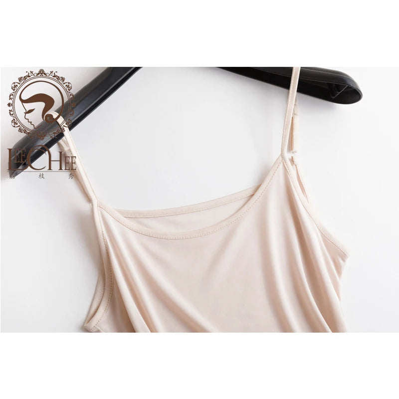 a women's tank top hanging on a hanger