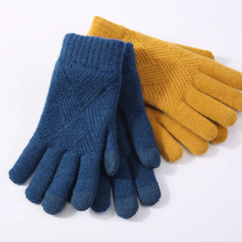 a pair of blue and yellow gloves sitting on top of each other