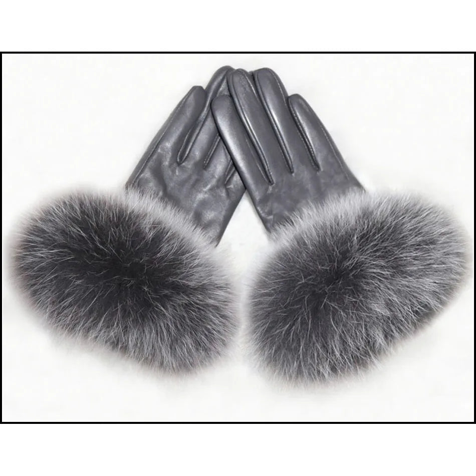 a pair of gloves with fur on top of it