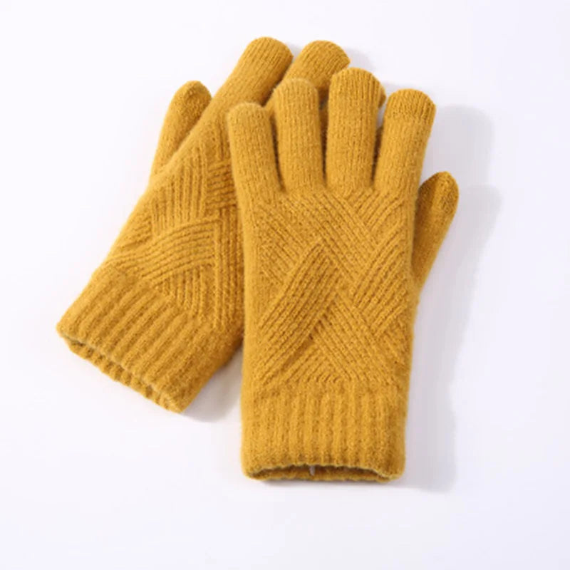 a pair of yellow knitted gloves on a white background