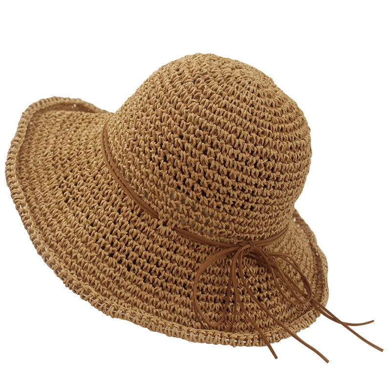 a straw hat with a brown ribbon around the brim