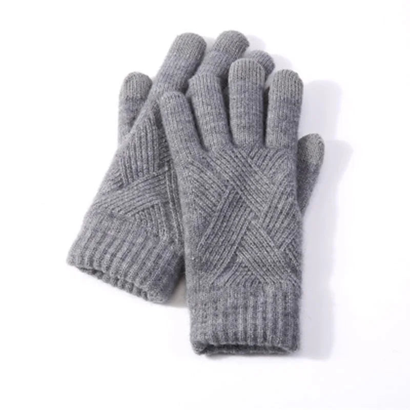 a pair of gray knitted gloves on a white background