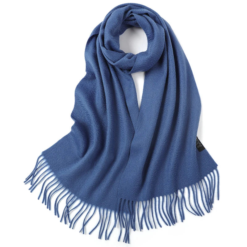 a blue scarf with fringes on a white background