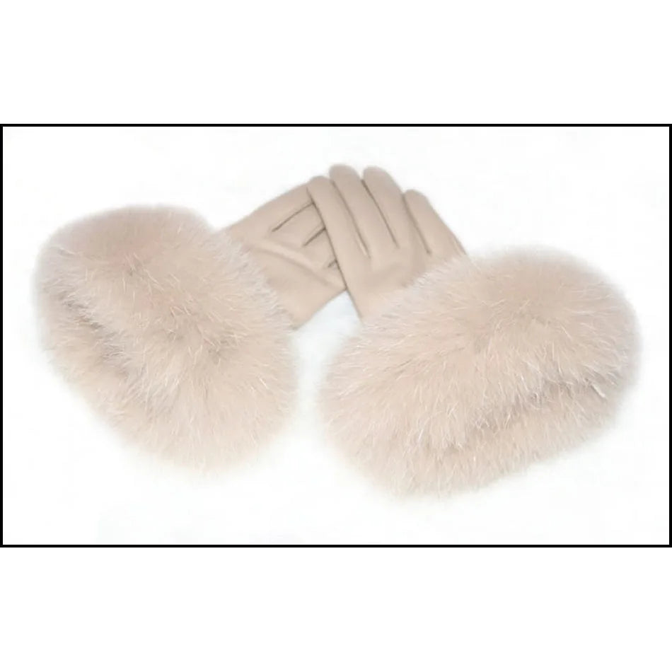 a pair of gloves with fur on top of it