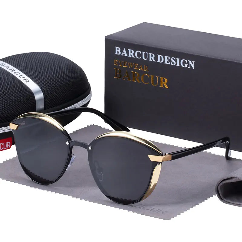 a pair of sunglasses sitting next to a box