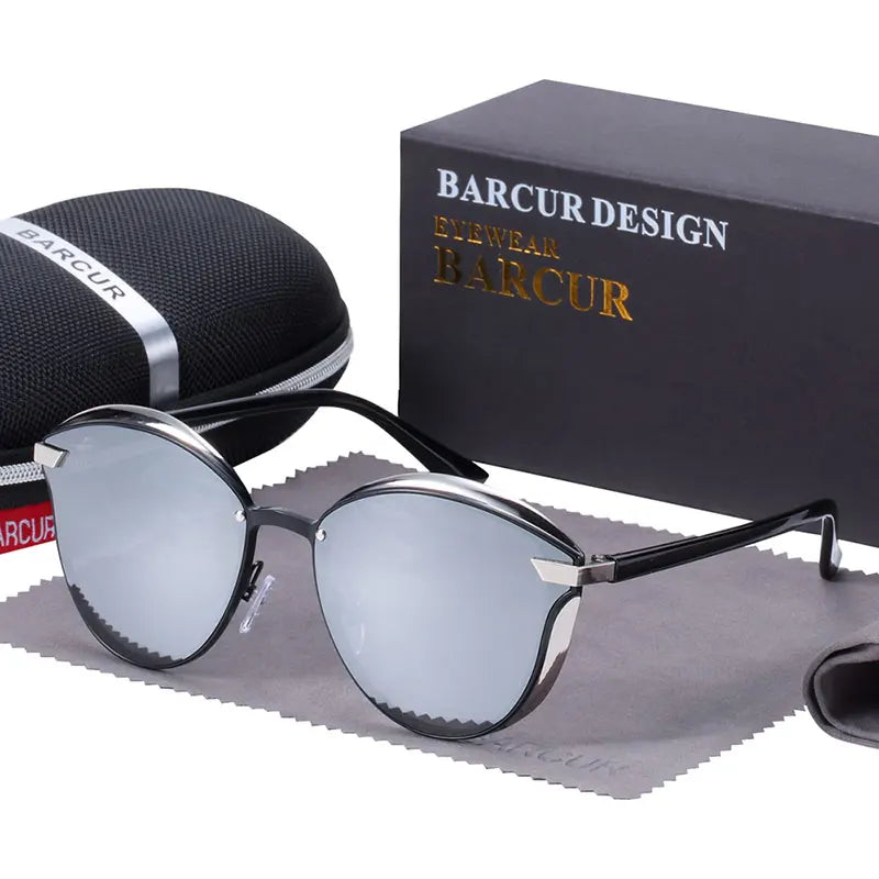 a pair of sunglasses sitting next to a box