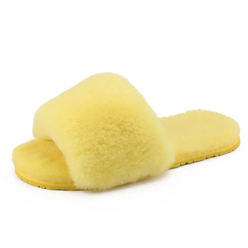 a pair of yellow slippers on a white background