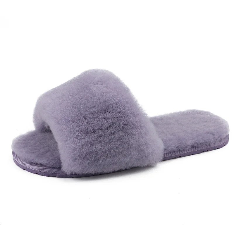 a pair of purple slippers on a white background