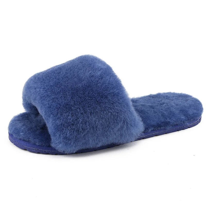 a pair of blue slippers on a white background