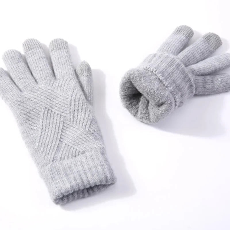 a pair of gloves sitting on top of a white table