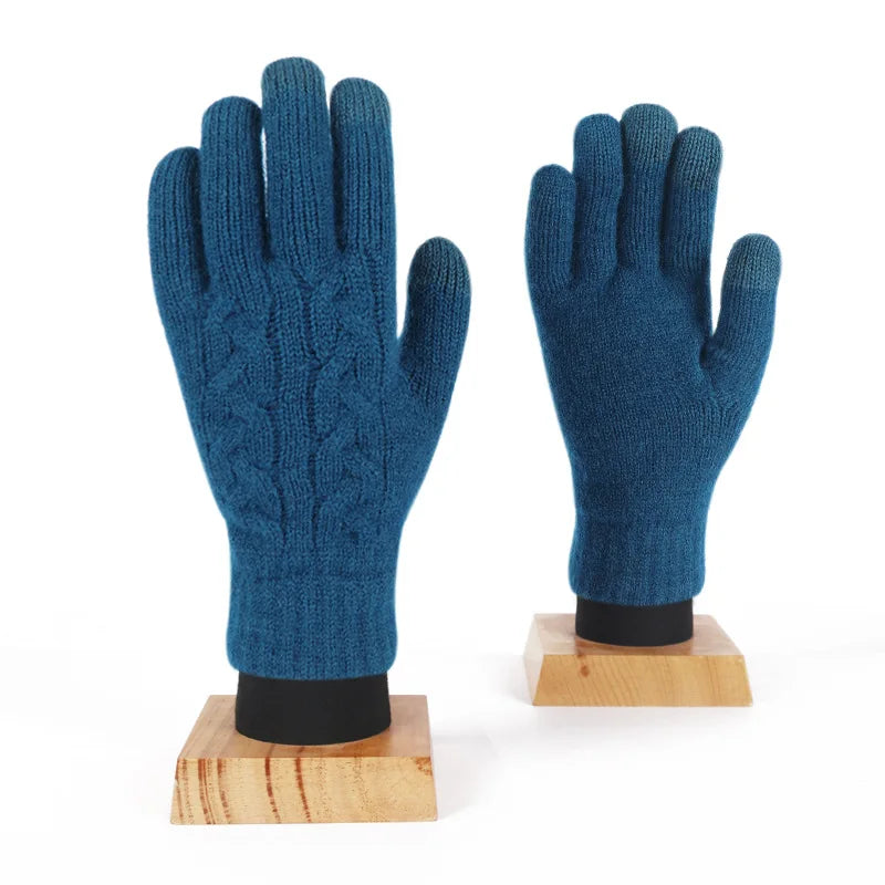 a pair of blue gloves sitting on top of a wooden stand