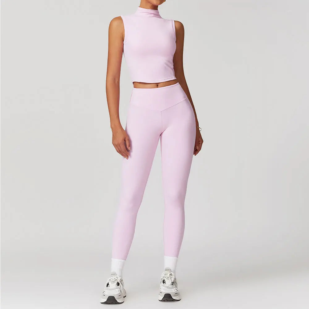 a woman in a pink crop top and leggings