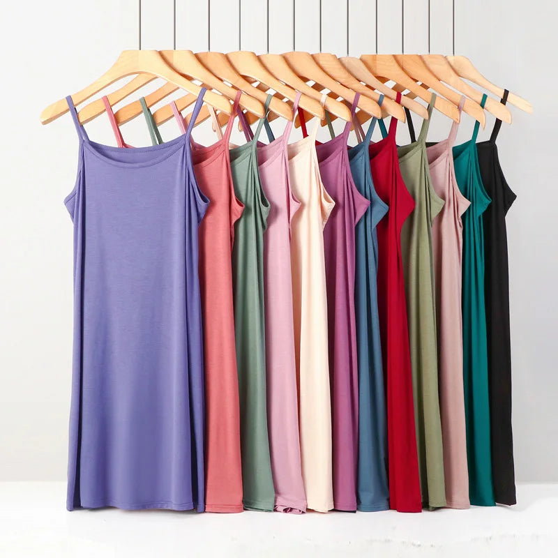 a rack of dresses hanging on a clothes rack