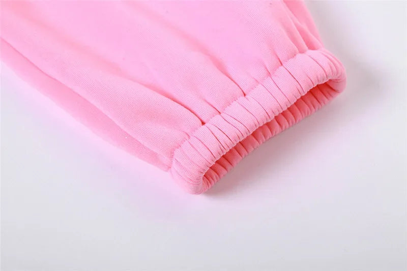 a close up of a pink shirt on a white background