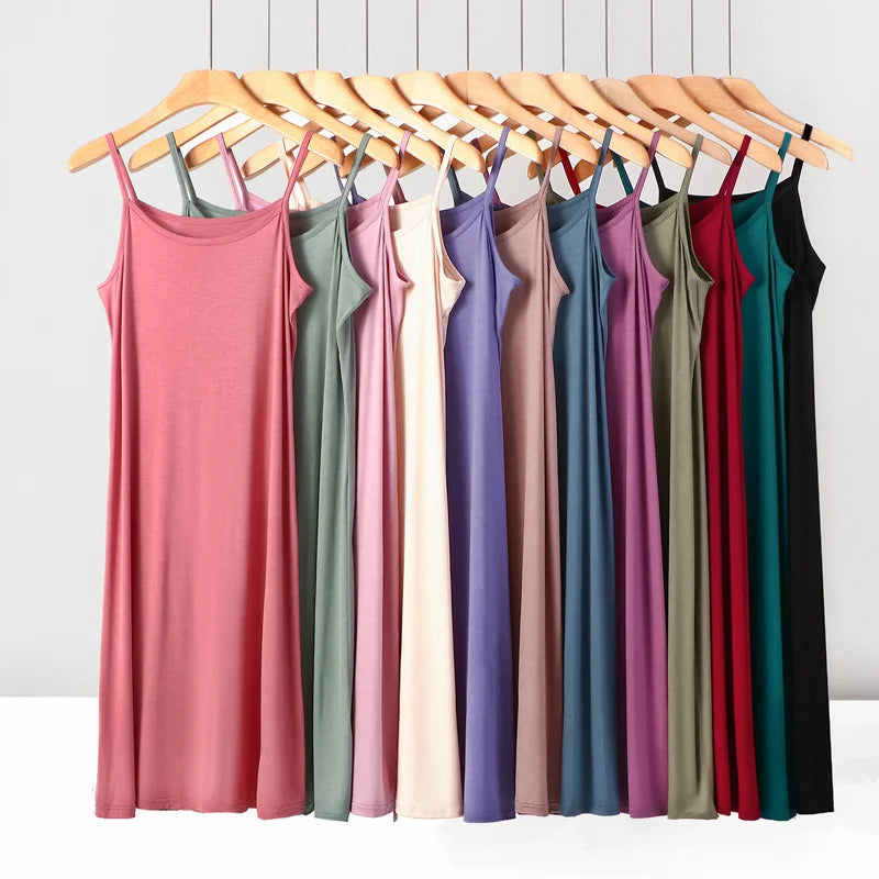 a rack of women's tank tops hanging on a rack