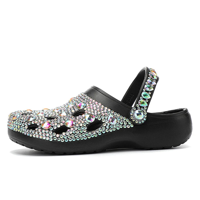 a women's black sandal with multicolored stones