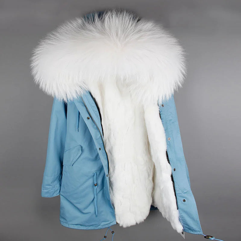 a blue and white jacket with a fur collar