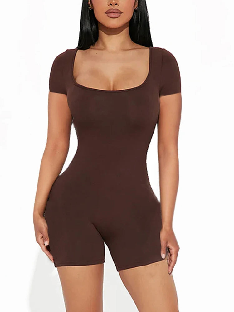 a woman in a short brown bodysuit