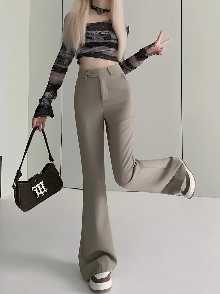 a woman with long blonde hair holding a handbag