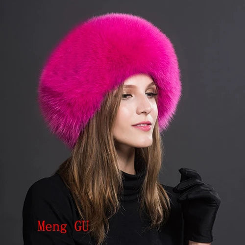 Vibrant pink natural fox fur hat worn by a model, adding a pop of color to winter attire.