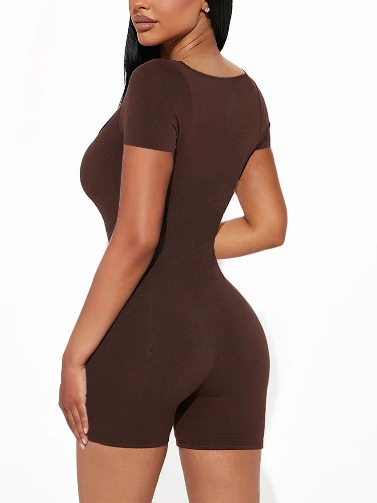 a woman in a brown bodysuit