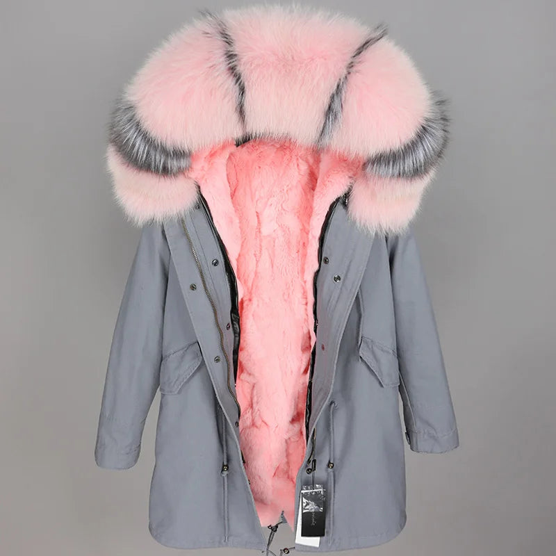 a grey parka with a pink fur collar