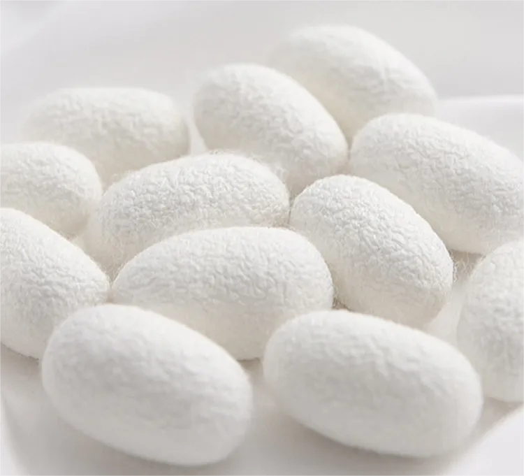 a pile of white marshmallows on a white surface