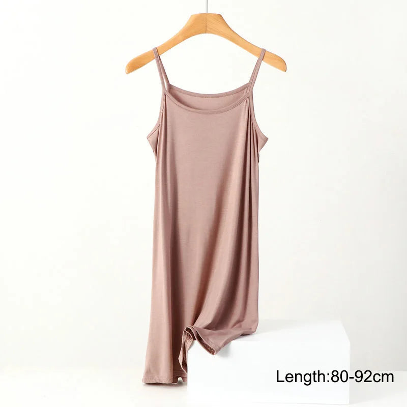 a women's tank top hanging on a hanger