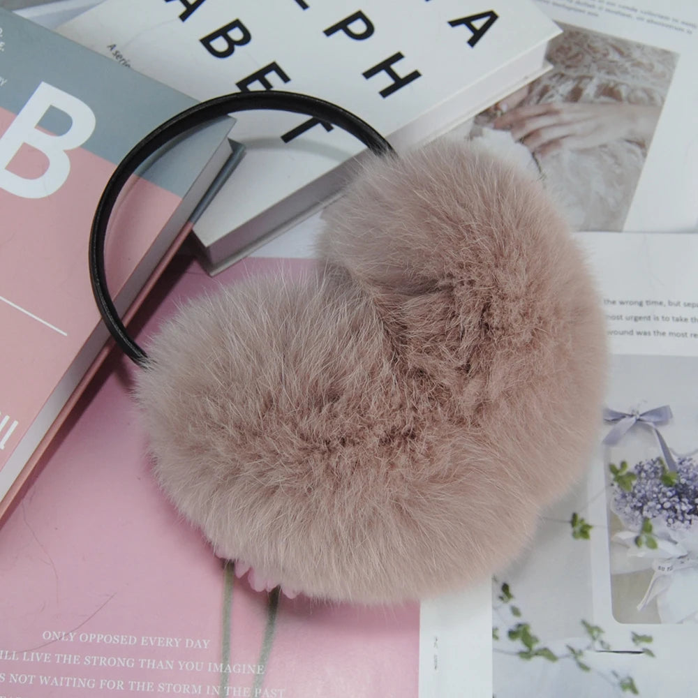 a pair of glasses and a fur ball on top of a magazine