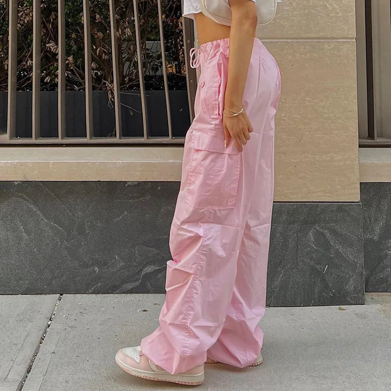 a woman in pink pants and a white shirt