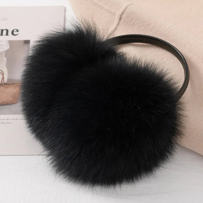 a black furry ball on top of a magazine