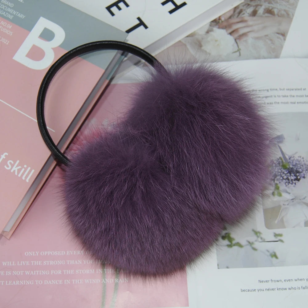 a purple fur ball on top of a magazine