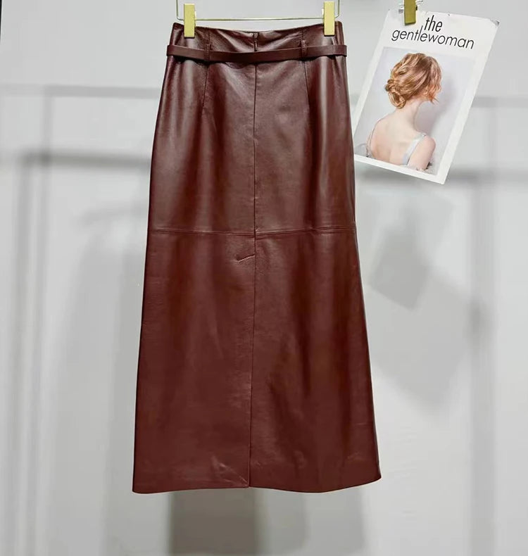 a brown leather skirt hanging on a clothes hanger