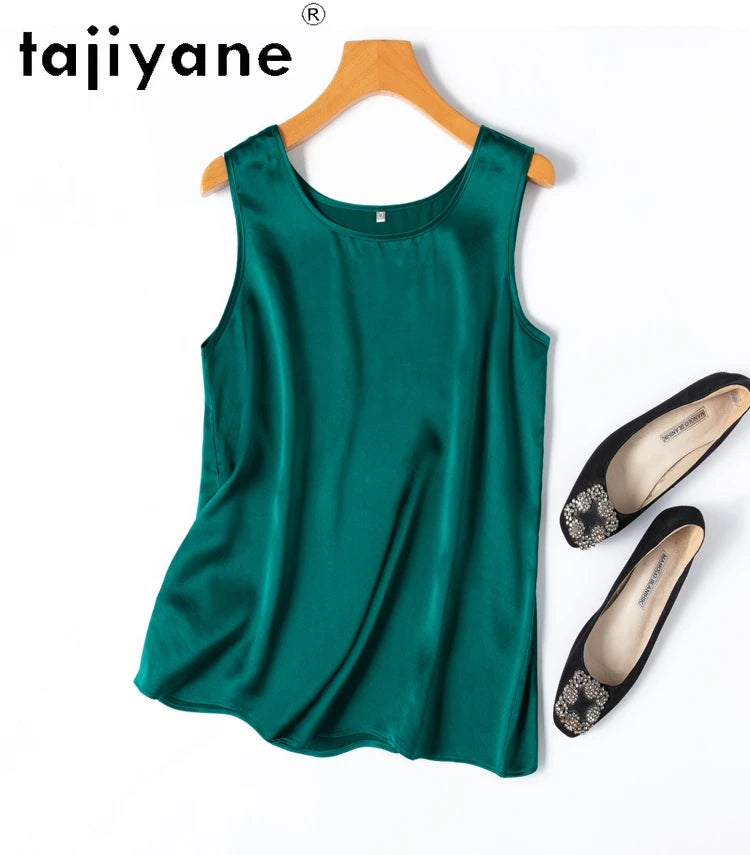 a pair of shoes and a green top on a hanger