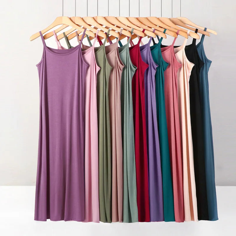 a rack of dresses hanging on a clothes rack