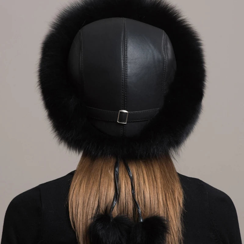 Back view of a black natural fox fur hat, highlighting the leather details and adjustable straps.