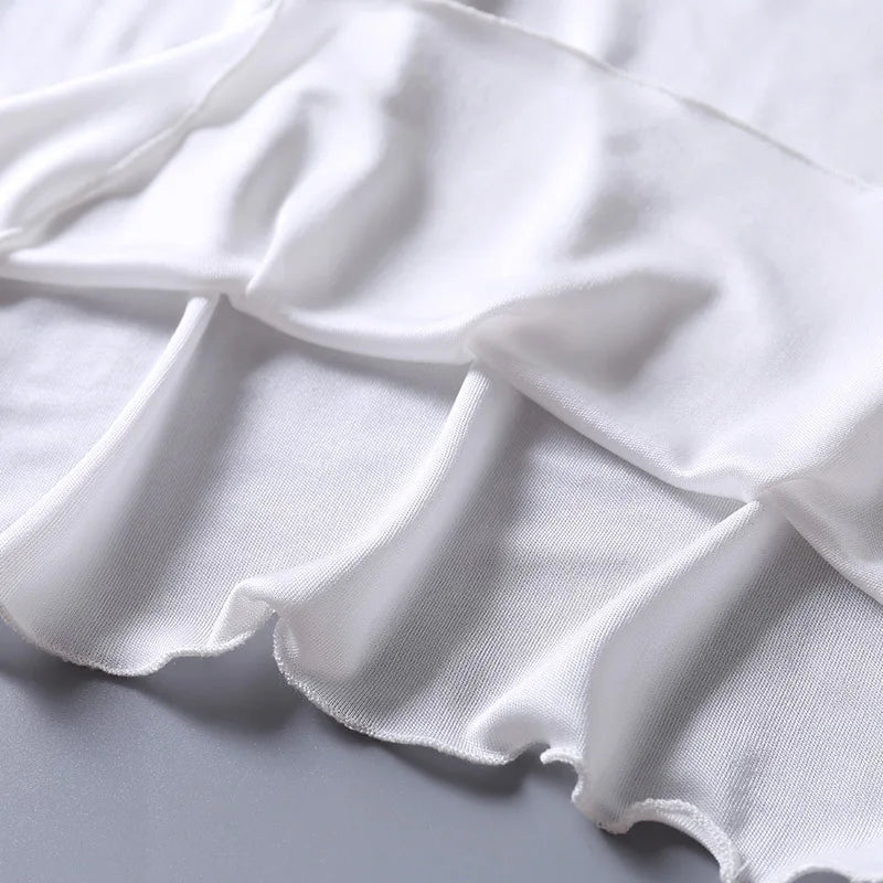 a close up of a white sheet on a bed