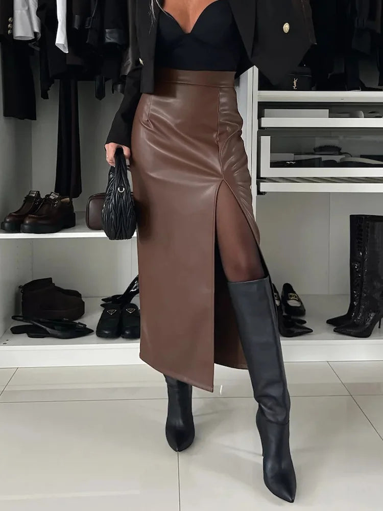 a woman in a black top and brown leather skirt