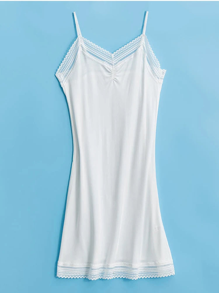 a women's white tank top on a blue background
