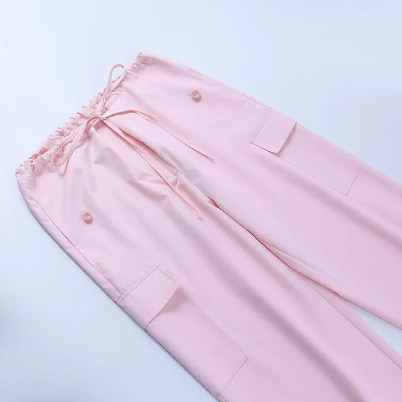 a pair of pink pants laying on top of a white table