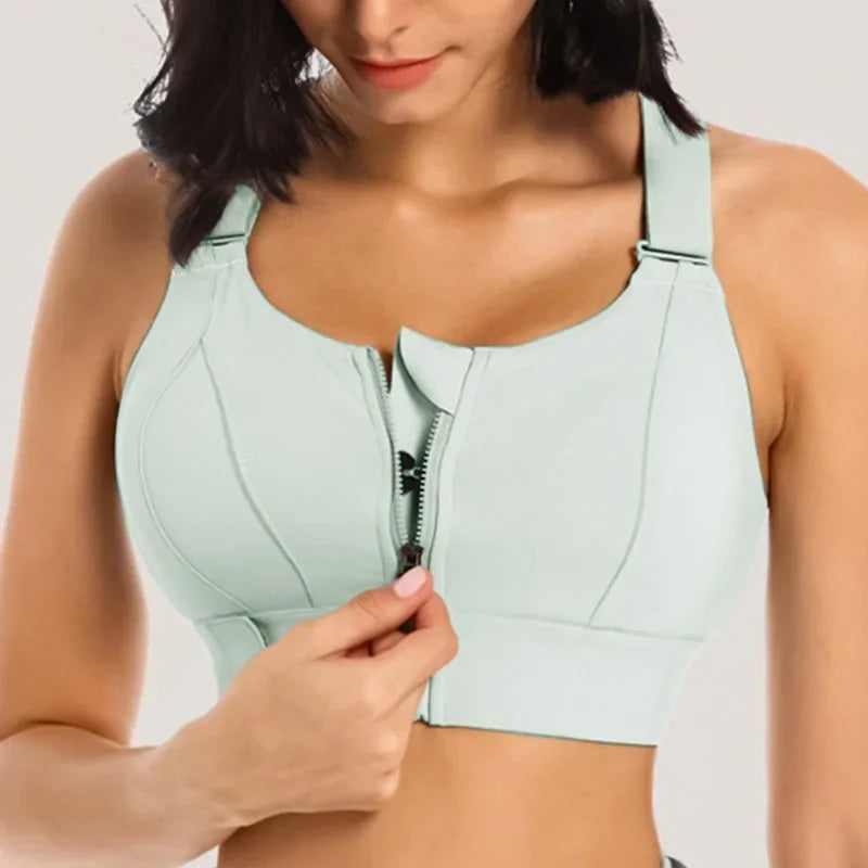 a woman wearing a light blue sports bra top