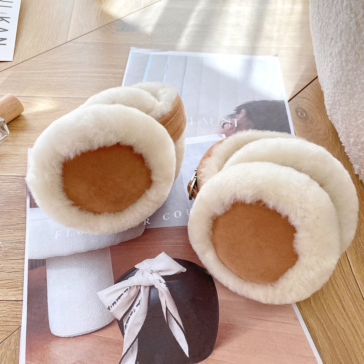 a pair of slippers sitting on top of a magazine