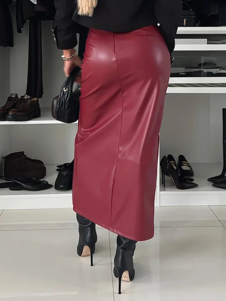 a woman in a black shirt and red leather skirt