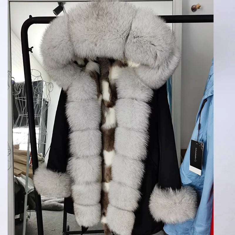 a coat with a fur collar on a rack