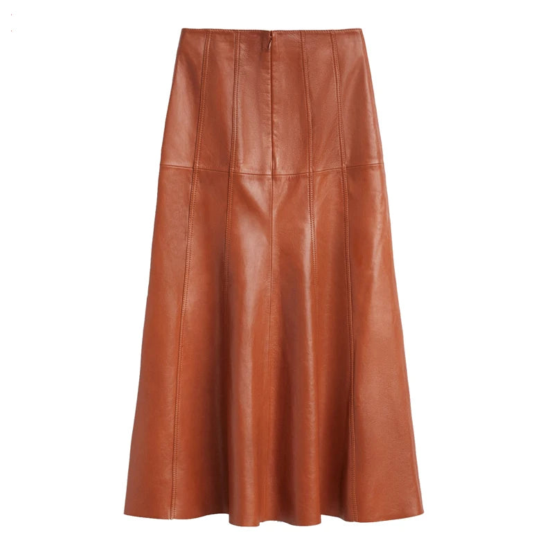 a woman wearing a brown leather skirt