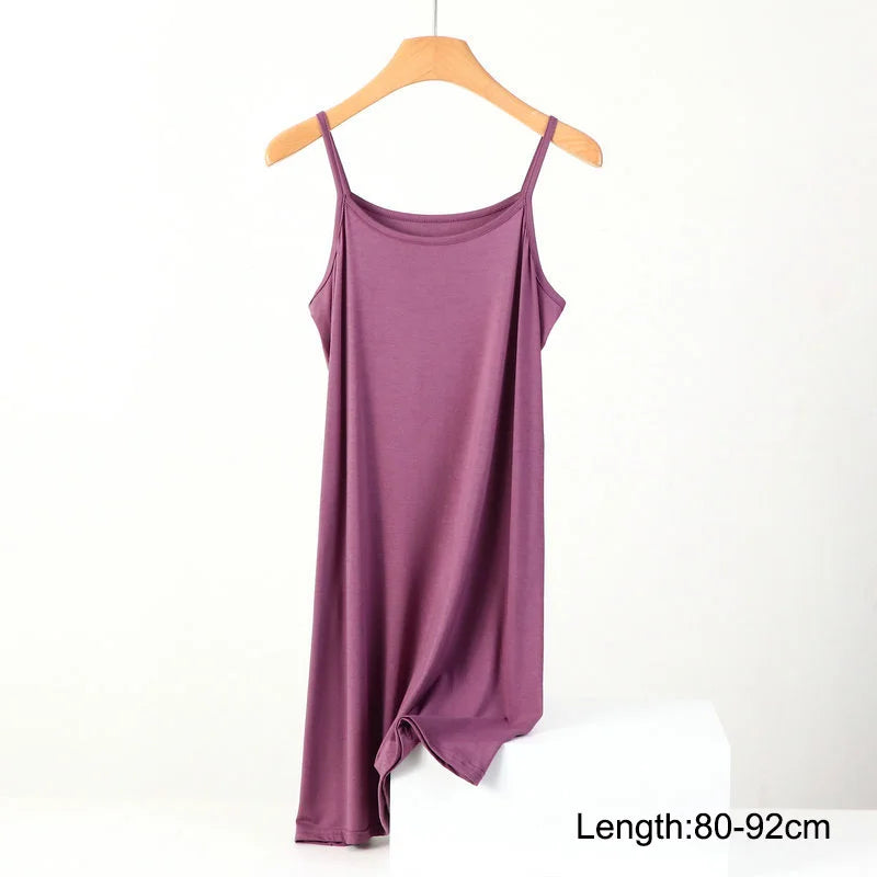 a purple tank top hanging on a hanger