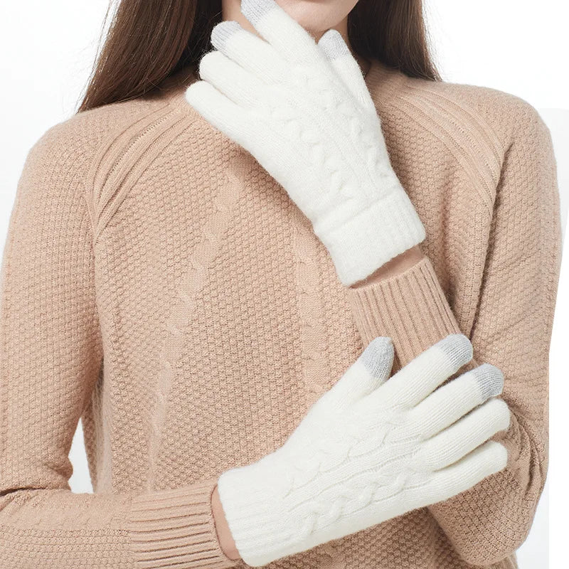 a woman wearing white gloves and a sweater