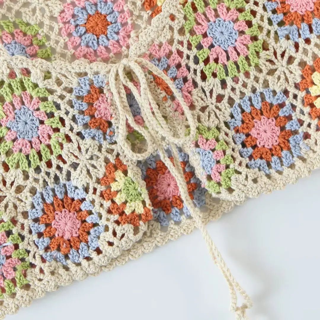 a close up of a crocheted bag on a table