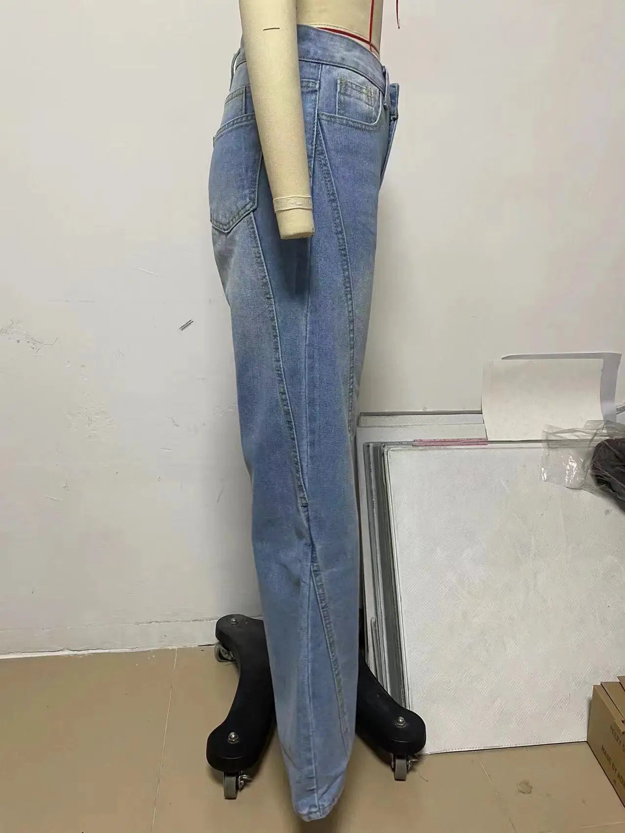 a mannequin wearing jeans and a white shirt